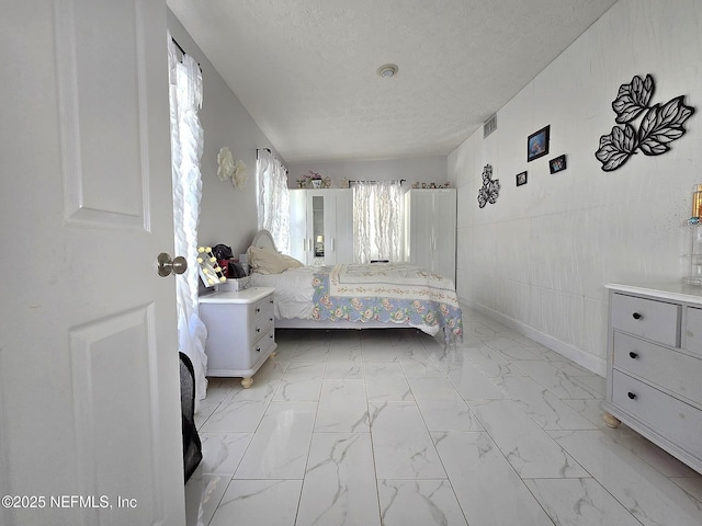 bedroom featuring a textured ceiling