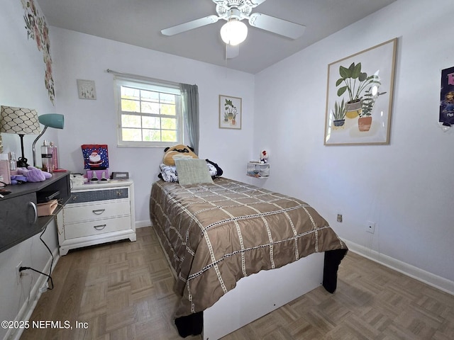 bedroom featuring parquet floors and ceiling fan