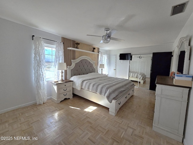 bedroom featuring ceiling fan and light parquet flooring