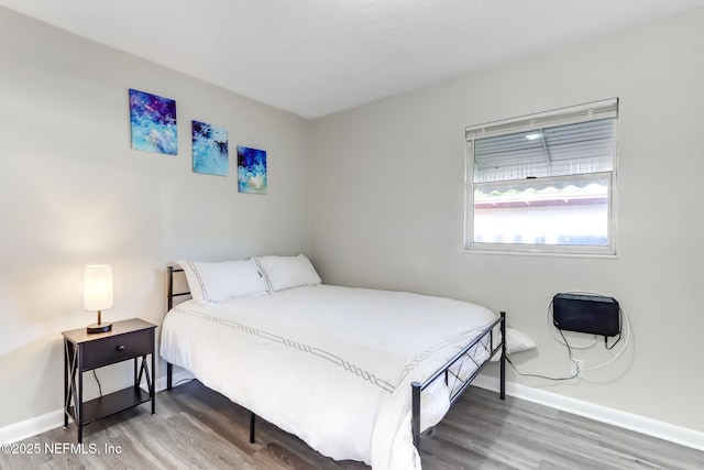 bedroom featuring wood-type flooring