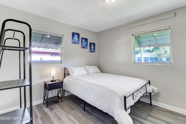 bedroom with hardwood / wood-style floors