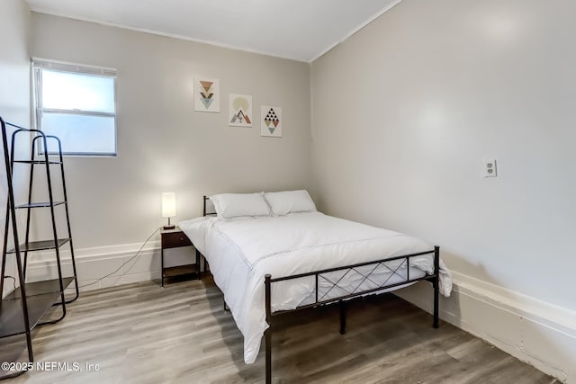 bedroom featuring hardwood / wood-style flooring