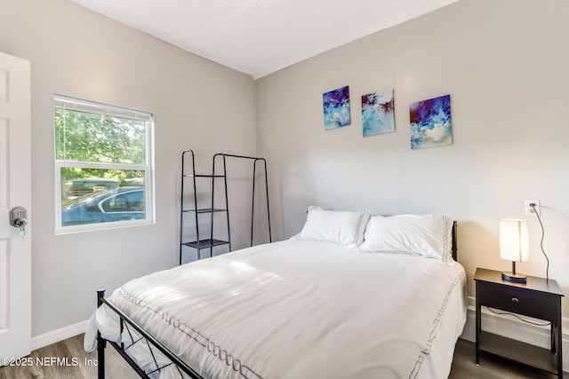 bedroom with hardwood / wood-style floors