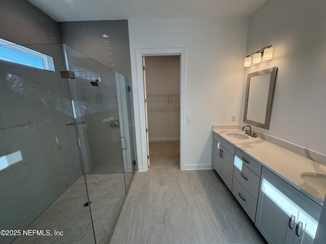 bathroom with vanity and an enclosed shower