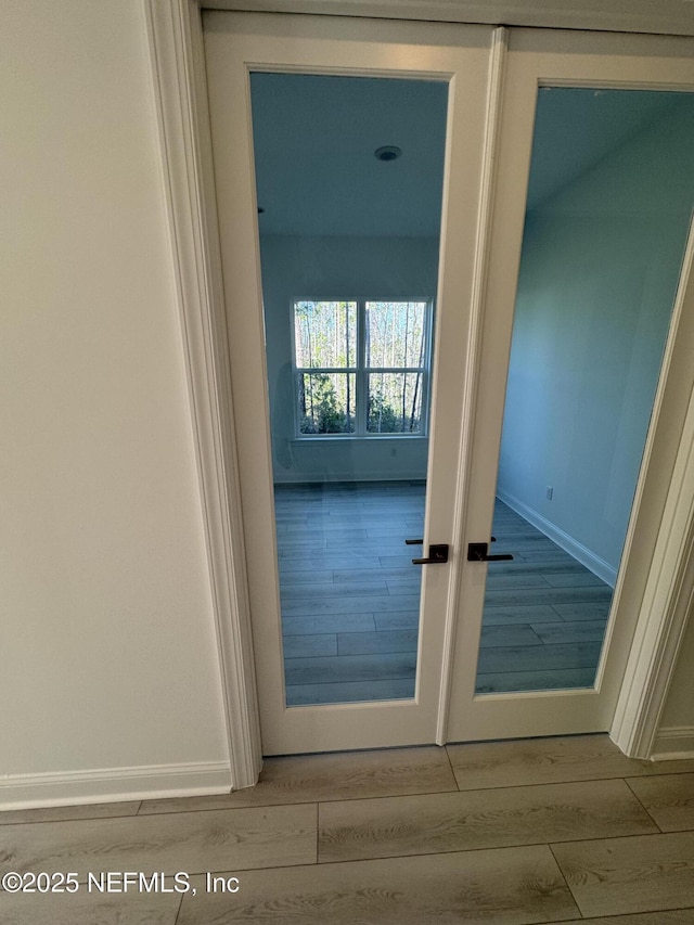 doorway to outside with light hardwood / wood-style flooring