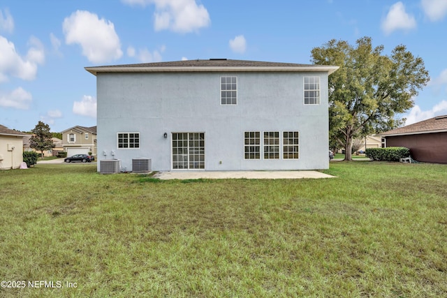 rear view of house featuring a patio, a yard, and cooling unit