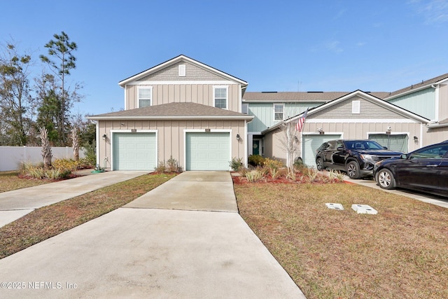 view of front of house featuring a garage and a front lawn