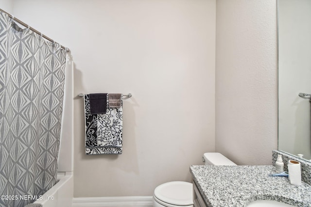 bathroom with toilet and vanity