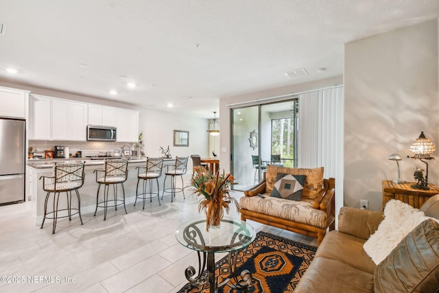 living room featuring light tile patterned flooring