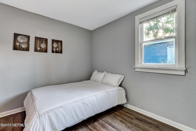 bedroom featuring dark hardwood / wood-style floors