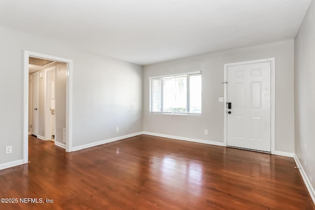 entrance foyer with dark hardwood / wood-style flooring