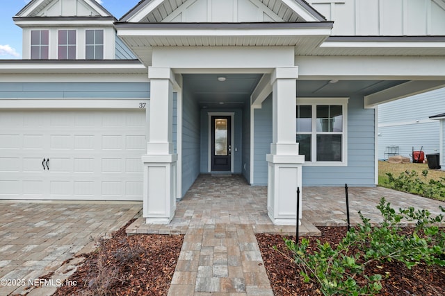 view of exterior entry featuring a garage