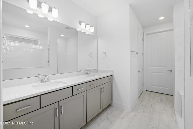 bathroom with vanity and hardwood / wood-style floors