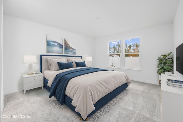 bedroom with light colored carpet