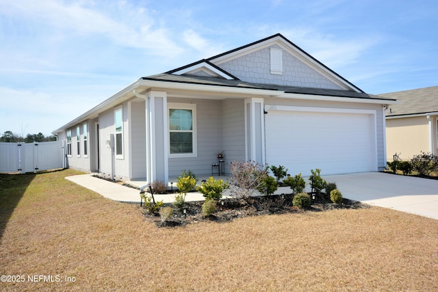 ranch-style house featuring a garage and a front lawn