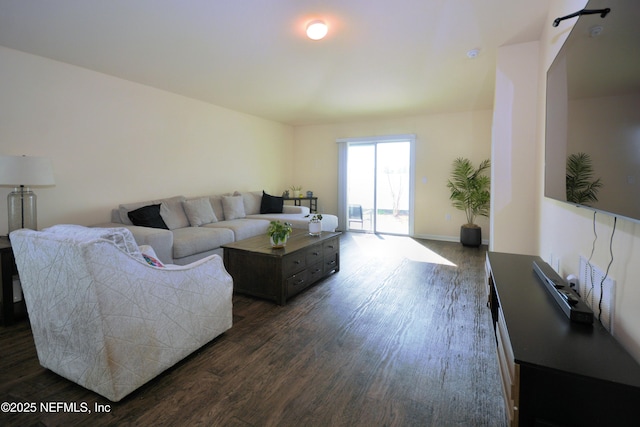 living room featuring dark wood-type flooring