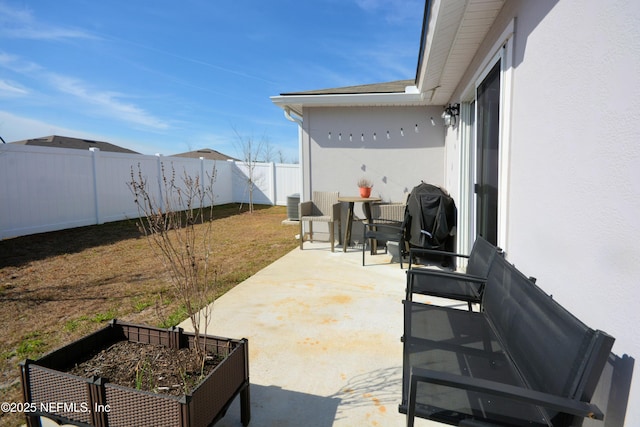 view of patio / terrace featuring a grill and cooling unit