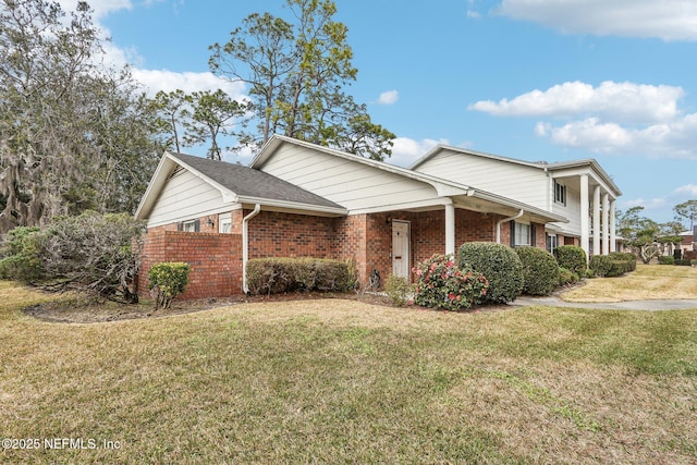 view of property exterior featuring a lawn