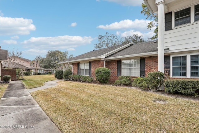 view of home's exterior with a lawn