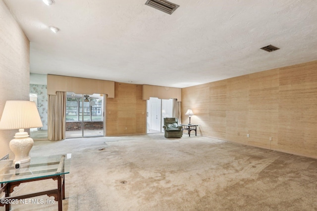 unfurnished living room with carpet