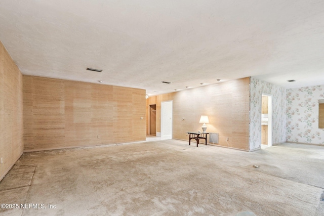 spare room featuring light colored carpet