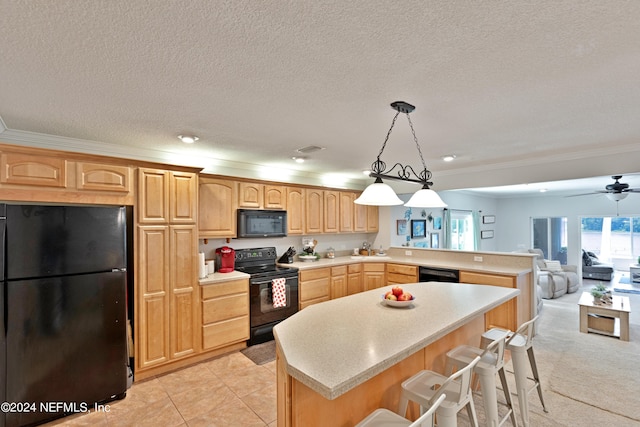 kitchen with ceiling fan, decorative light fixtures, a kitchen breakfast bar, crown molding, and black appliances