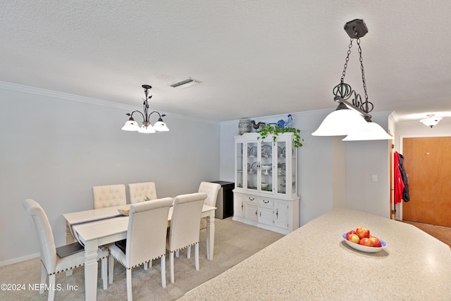 carpeted dining room featuring a textured ceiling, an inviting chandelier, and ornamental molding