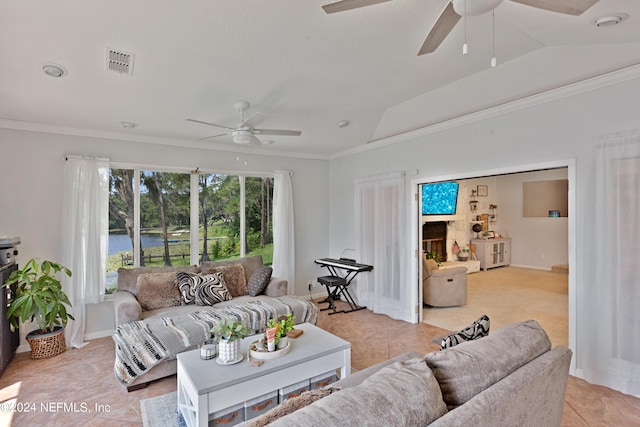 living room with light tile patterned floors, crown molding, and vaulted ceiling