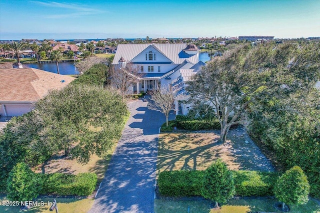 birds eye view of property with a water view