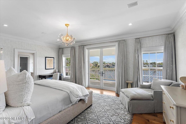 bedroom featuring wood-type flooring, crown molding, access to outside, and an inviting chandelier