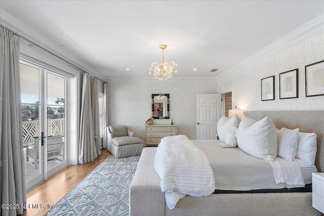 bedroom featuring access to exterior, crown molding, a chandelier, and light hardwood / wood-style flooring