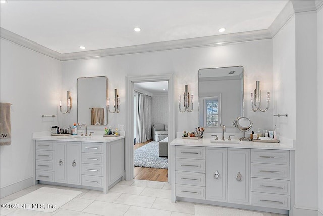 bathroom with vanity, tile patterned flooring, and ornamental molding