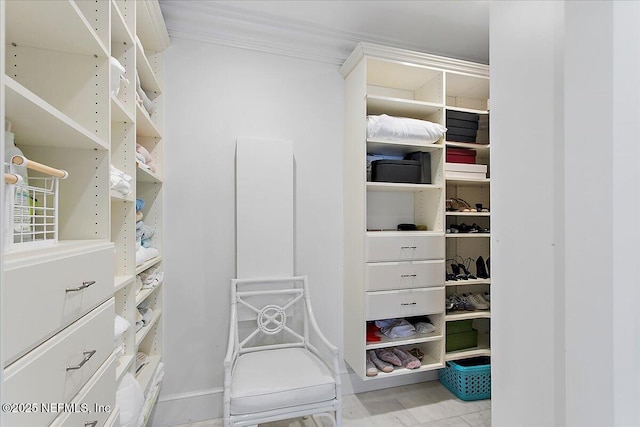 spacious closet featuring light tile patterned floors