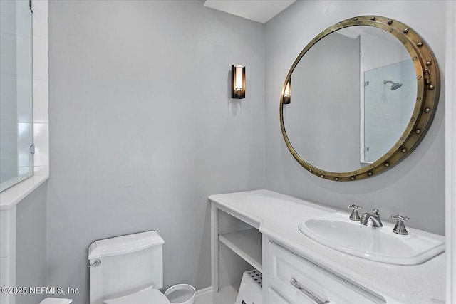 bathroom featuring toilet and vanity