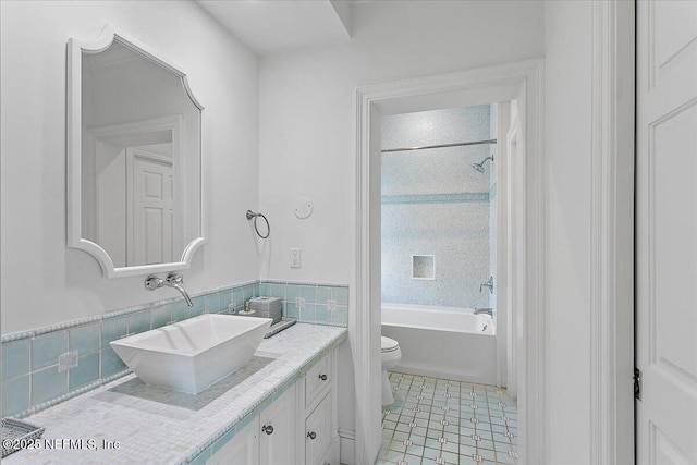 full bathroom with toilet, vanity, tile patterned flooring, and bathtub / shower combination