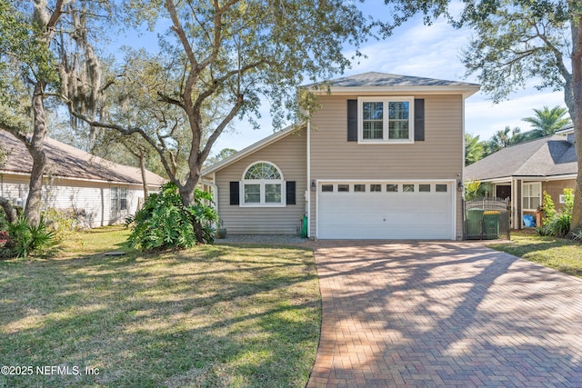 view of front property with a garage and a front yard