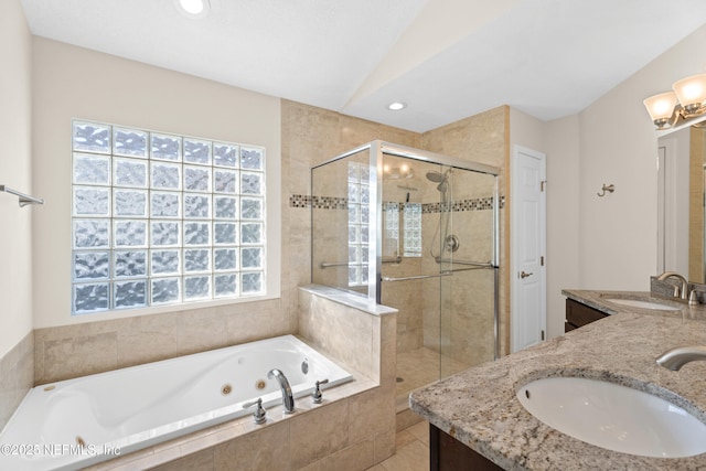 bathroom with vanity and separate shower and tub