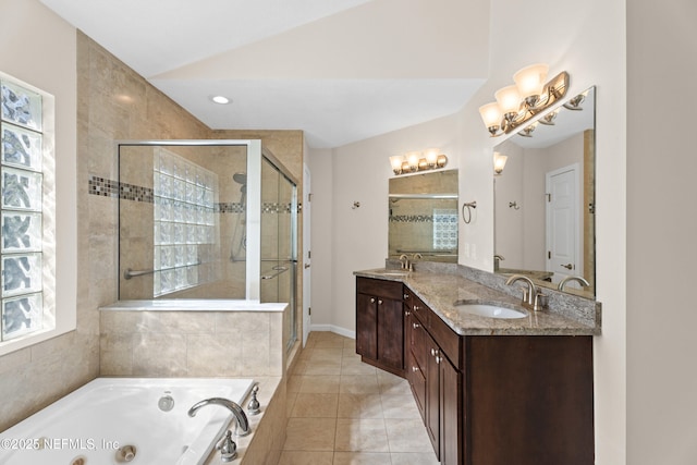 bathroom featuring tile patterned flooring, plus walk in shower, lofted ceiling, and vanity