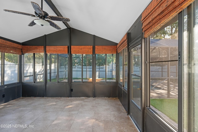 unfurnished sunroom with lofted ceiling with beams and ceiling fan