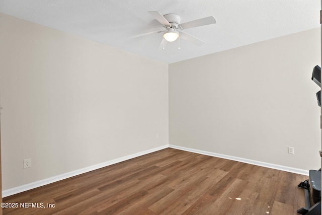 unfurnished room featuring ceiling fan and wood-type flooring