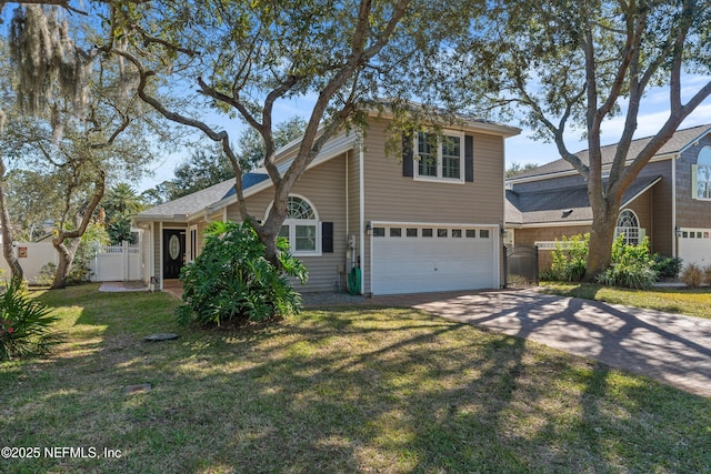 view of front of home with a garage and a front yard