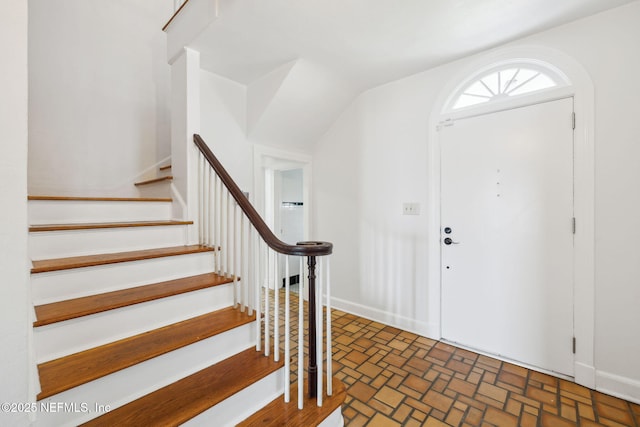 entryway featuring lofted ceiling