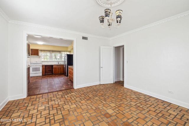 interior space with crown molding and an inviting chandelier