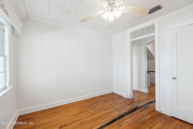 unfurnished room with crown molding, ceiling fan, and wood-type flooring