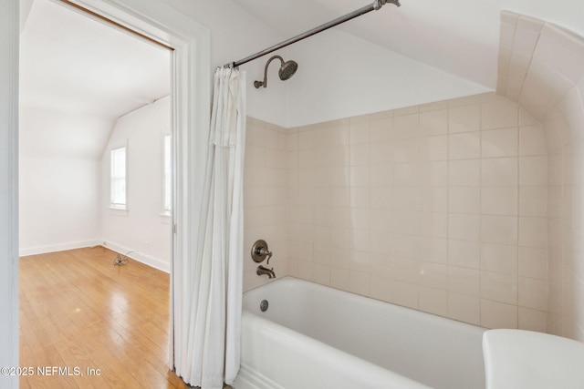 bathroom featuring hardwood / wood-style flooring and shower / bath combo