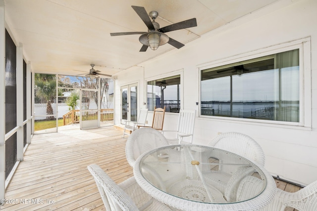 sunroom / solarium with ceiling fan