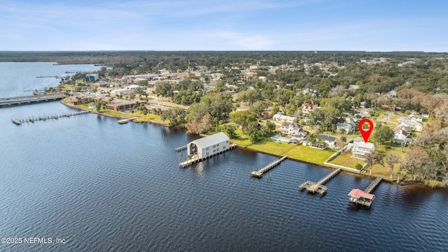 birds eye view of property with a water view