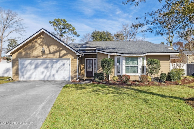 ranch-style home with a front yard and a garage