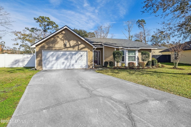 ranch-style home with a front yard and a garage