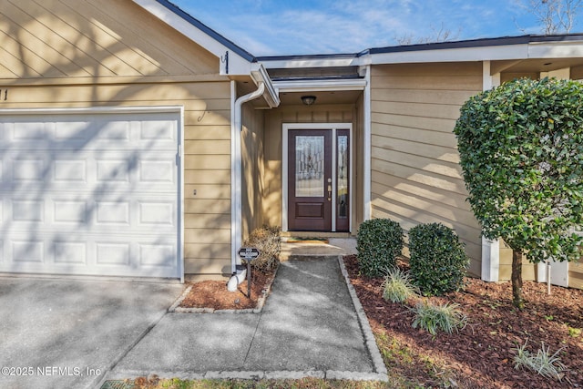 property entrance with a garage